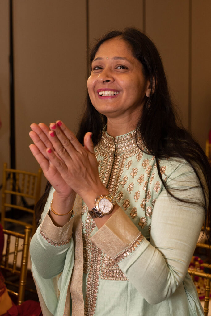 wedding guest clapping during Haldi