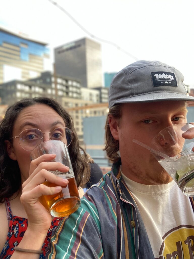 Crysahna and Allen drinking a beer