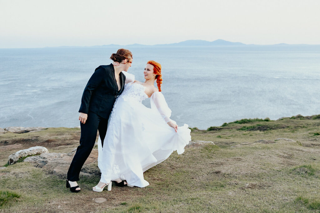 two brides at Neist point. the Atlantic ocean is visible from the cliffs