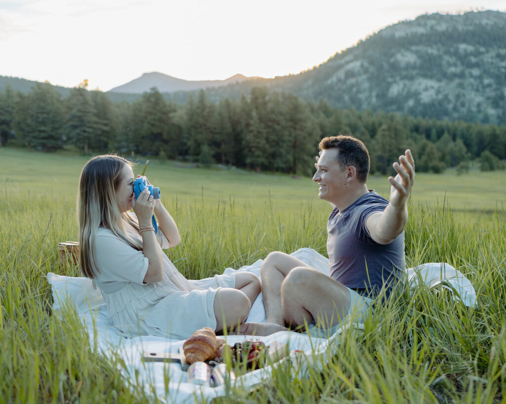 unique couple having a polarpid photoshoot and a picnic